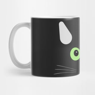 Face of a green-eyed cat Mug